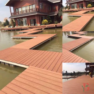 Multi-level composite decking installation in redwood color, showing architectural integration