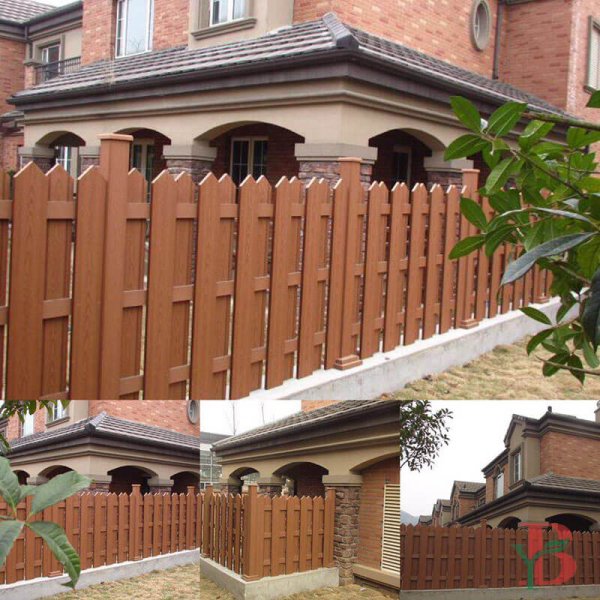 Traditional-style composite slatted fence in warm brown tones, featuring classic picket design with architectural detailing.
