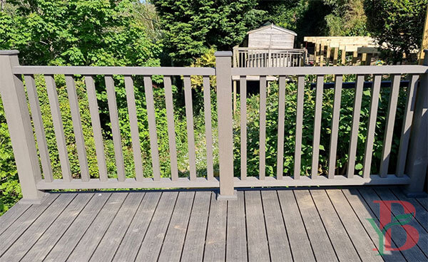 Durable WPC materials in residential deck and railing application. Grey composite construction demonstrating weather resistance and low maintenance features.