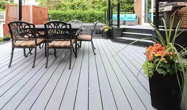 Modern rooftop terrace featuring 3D embossed WPC decking with outdoor furniture