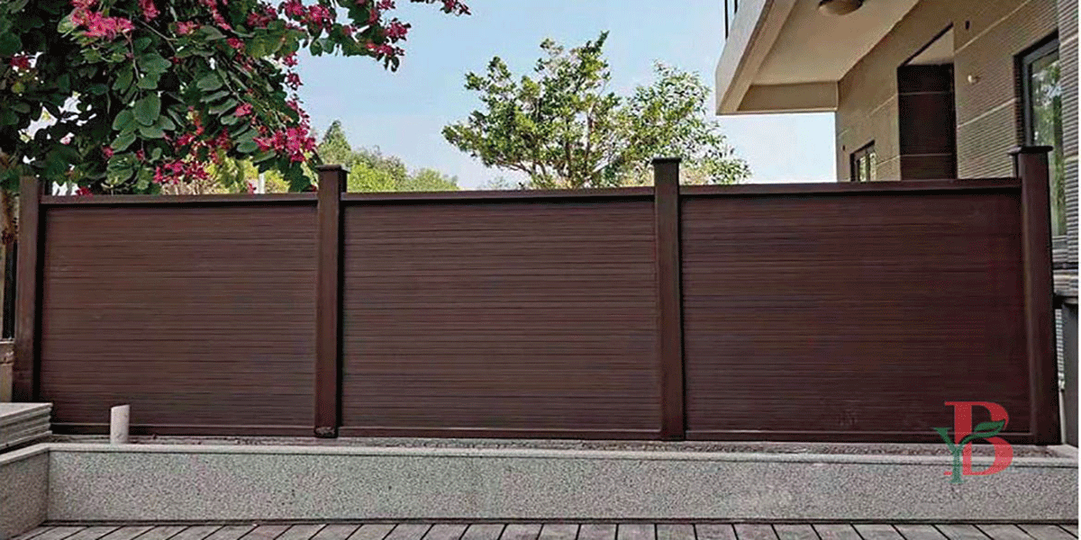 Completed horizontal WPC privacy fence installation in a backyard