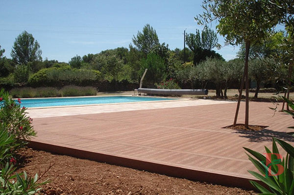 Bongywood composite deck with transition breaker board near a swimming pool