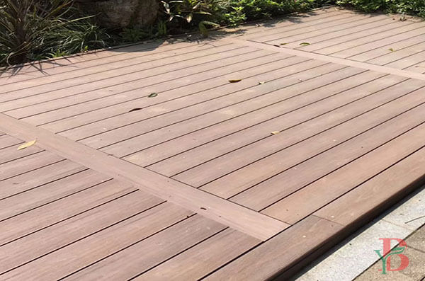 A composite deck featuring a perpendicular breaker board for aesthetic transition.