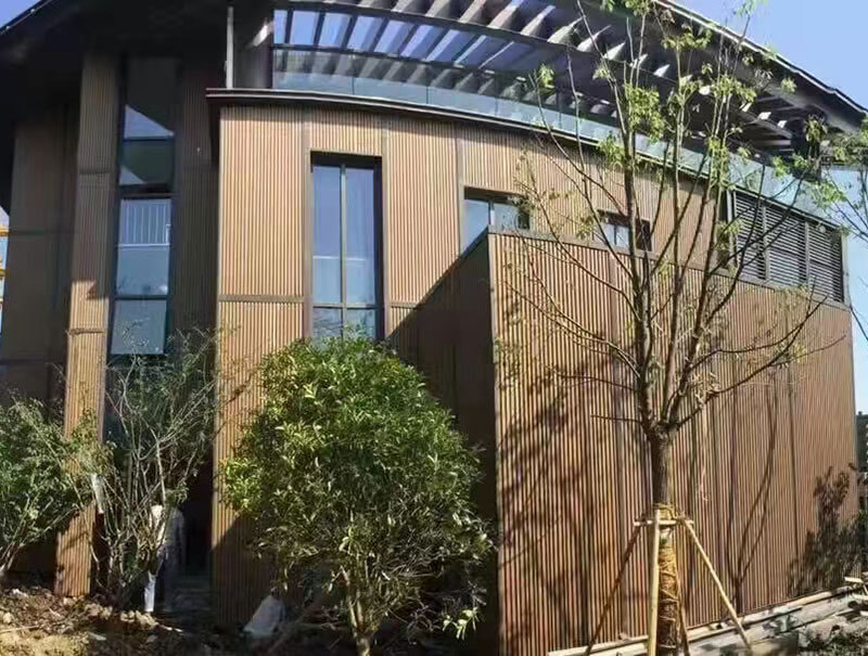 Modern WPC slat wall panel installed on a commercial building facade