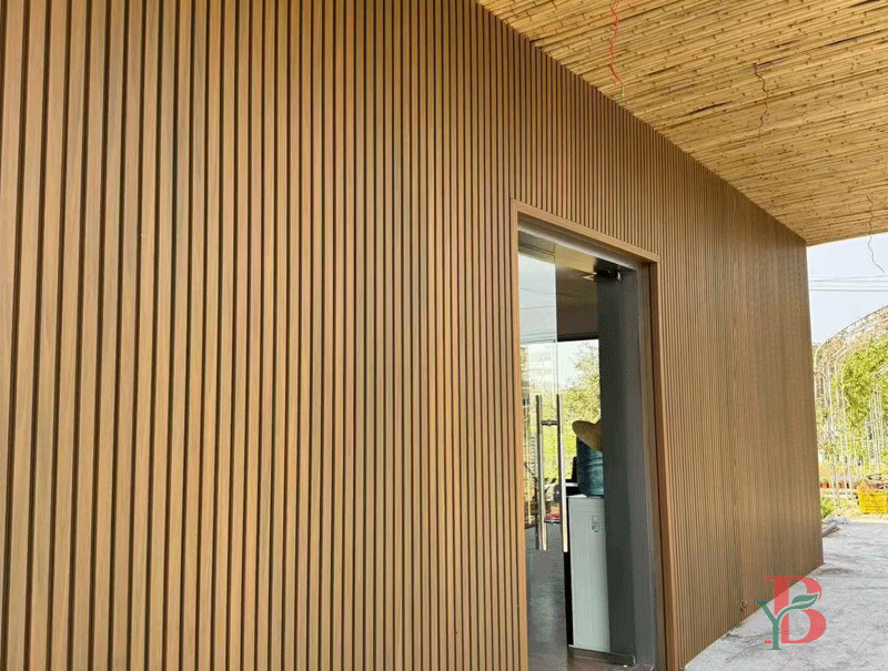 Vertical WPC slat wall panel on modern building exterior