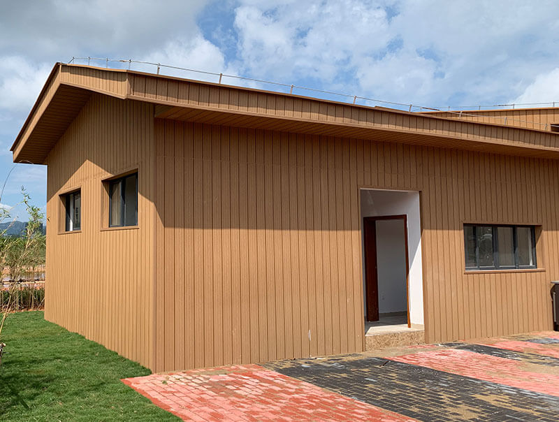 Rustic-style cottage in warm-toned WPC wall panels
