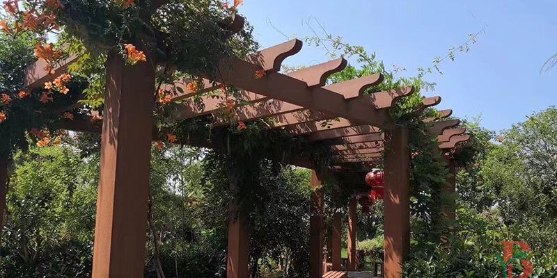 Traditional Classic WPC pergola with curved beams and climbing plants