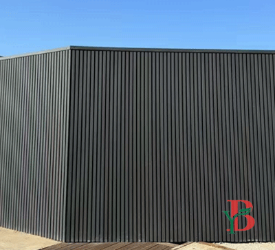 Modern dark grey horizontal WPC fluted wall panles for a residential courtyard.