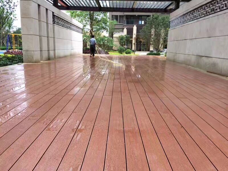 Light brown Classical WPC decking under a concrete structural pavilion