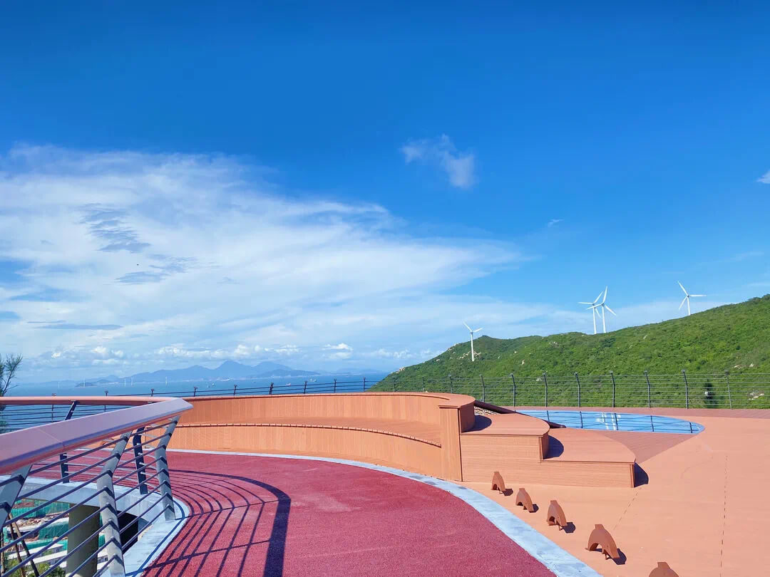 Close-up of WPC decking stairs and platform in an outdoor landscape project.