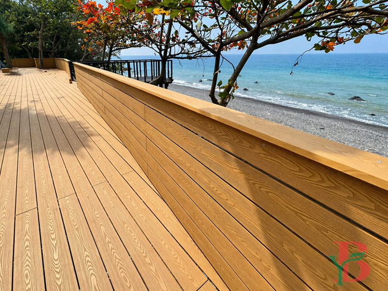 3D embossed WPC decking installed on a coastal outdoor walkway with sea view