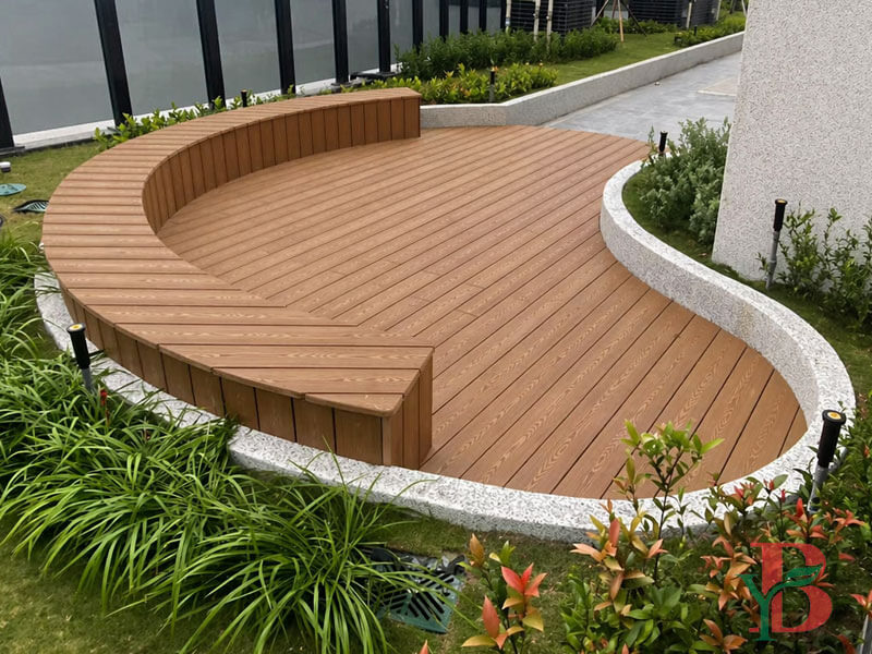 custom curved landscape deck made with 3D embossed WPC decking in an outdoor garden area