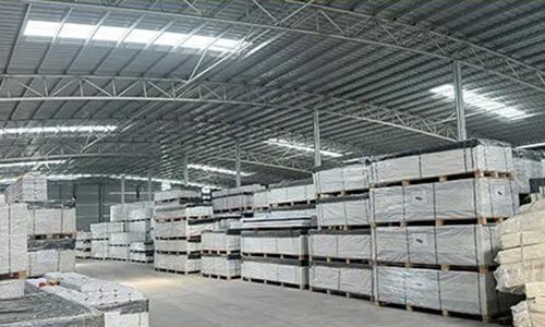 Large WPC warehouse with organized inventory and bulk stock for reliable supply chain support