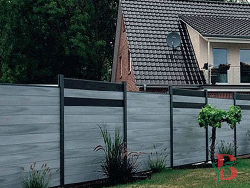 Bongywood WPC fencing system installed around private garden with natural greenery background
